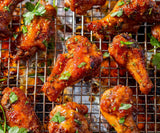 Chicken wings with herbs and a caramel glaze.